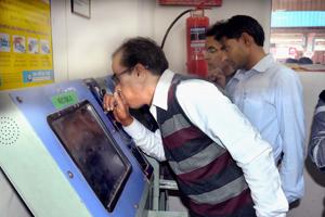 A railway employee uses breathalyser to mark attendance at Jaipur station.(Prabhakar Sharma/HT) A railway employee uses breathalyser to mark attendance at Jaipur station.(Prabhakar Sharma/HT)