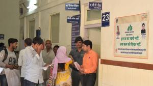 Room number 23 at Sawai Man Singh (SMS) Hospital. There is a poster on the wall which erroneously depicts Rajendra Singh Rathore as the health minister, who has been replaced by Kali Charan Saraf.(Prabhakar Sharma/HT Photo) Room number 23 at Sawai Man Singh (SMS) Hospital. There is a poster on the wall which erroneously depicts Rajendra Singh Rathore as the health minister, who has been replaced by Kali Charan Saraf.(Prabhakar Sharma/HT Photo)
