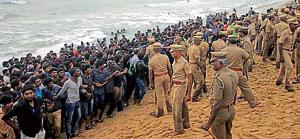 Protestors supporting Jallikattu, a traditional bull-taming ritual, try to form a human chain as police try to remove them from the Marina beach in Chennai.(AP File Photo) Protestors supporting Jallikattu, a traditional bull-taming ritual, try to form a human chain as police try to remove them from the Marina beach in Chennai.(AP File Photo)