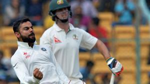 Virat Kohli celebrates after the dismissal of Australian batsman Mitchell Marsh on Day 2 of the second Test match between India and Australia in Bangalore on Sunday.(AFP) Virat Kohli celebrates after the dismissal of Australian batsman Mitchell Marsh on Day 2 of the second Test match between India and Australia in Bangalore on Sunday.(AFP)