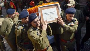 Kashmir DGP SP Vaid (right) and IGP SJM Gillani along with senior officers carry the body of constable Manzoor Ahmad who was killed during an encounter in Tral on March 5.(PTI photo) Kashmir DGP SP Vaid (right) and IGP SJM Gillani along with senior officers carry the body of constable Manzoor Ahmad who was killed during an encounter in Tral on March 5.(PTI photo)