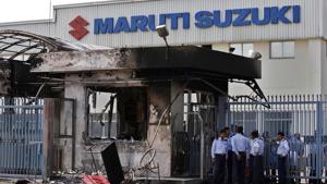 Security guards stand near a burnt down reception block of Maruti Suzuki factory in Manesar, near New Delhi, in July 2012.(AP File Photo) Security guards stand near a burnt down reception block of Maruti Suzuki factory in Manesar, near New Delhi, in July 2012.(AP File Photo)