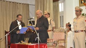 Bihar governor Ram Nath Kovind administering oath of office to Patna high court chief justice Rajendra Menon (left), in Patna on Thursday.(HT photo) Bihar governor Ram Nath Kovind administering oath of office to Patna high court chief justice Rajendra Menon (left), in Patna on Thursday.(HT photo)