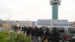 French Police unit (Raid) secure the area at Paris' Orly airport following the shooting of a man by French security forces. Security forces at Paris' Orly airport shot dead a man who took a weapon from a soldier, the interior ministry said.(AFP Photo) French Police unit (Raid) secure the area at Paris' Orly airport following the shooting of a man by French security forces. Security forces at Paris' Orly airport shot dead a man who took a weapon from a soldier, the interior ministry said.(AFP Photo)