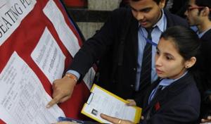 Class 12 students look for their seating arrangements on the notice board at an examination centre in New Delhi .(Hindustan Times File Photo) Class 12 students look for their seating arrangements on the notice board at an examination centre in New Delhi .(Hindustan Times File Photo)