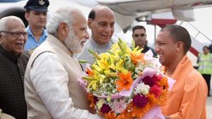 Uttar Pradesh chief minister Yogi Adityanath welcomes Prime Minister Narendra Modi before the swaering-in ceremony in Lucknow on Sunday.(PTI) Uttar Pradesh chief minister Yogi Adityanath welcomes Prime Minister Narendra Modi before the swaering-in ceremony in Lucknow on Sunday.(PTI)
