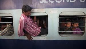 In the over-crowded network of the Indian Railways – where passengers are packed like sardines in compartments of most passenger trains – the possibility of finding reserved berths in alternative trains appear remote.(AP File) In the over-crowded network of the Indian Railways – where passengers are packed like sardines in compartments of most passenger trains – the possibility of finding reserved berths in alternative trains appear remote.(AP File)