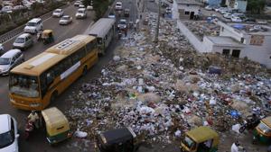 Garbage strewn along the roadside near Geeta Colony during the strike by municipal sanitation workers in June 2015.(Arun Sharma/HT Photo) Garbage strewn along the roadside near Geeta Colony during the strike by municipal sanitation workers in June 2015.(Arun Sharma/HT Photo)