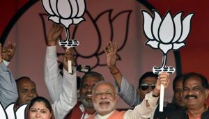 Prime Minister Narendra Modi holds the party symbol during a public rally at Barabanki constituency of Uttar Pradesh.(HT File Photo) Prime Minister Narendra Modi holds the party symbol during a public rally at Barabanki constituency of Uttar Pradesh.(HT File Photo)