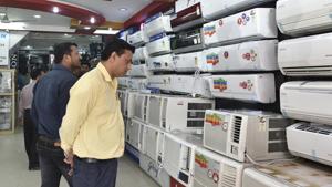 Customers check out air conditioners at a showroom in New Delhi on Friday.(Mohd Zakir/HT Photo) Customers check out air conditioners at a showroom in New Delhi on Friday.(Mohd Zakir/HT Photo)