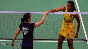 PV Sindhu (right) shakes hands with Saina Nehwal after winning the women's singles India Open superseries quarterfinal match at the Siri Fort Sports Complex in New Delhi on Friday.(AFP) PV Sindhu (right) shakes hands with Saina Nehwal after winning the women's singles India Open superseries quarterfinal match at the Siri Fort Sports Complex in New Delhi on Friday.(AFP)