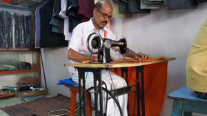 Tailor Buddhiram busy sewing the CM’s attire.(HT Photo) Tailor Buddhiram busy sewing the CM’s attire.(HT Photo)