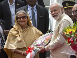 Prime Minister Narendra Modi greets Sheikh Hasina, his Bangladeshi counterpart, upon her arrival in New Delhi on Friday.(AP photo) Prime Minister Narendra Modi greets Sheikh Hasina, his Bangladeshi counterpart, upon her arrival in New Delhi on Friday.(AP photo)