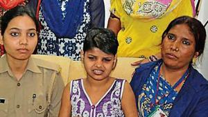 The girl (centre) who was found living with monkeys, at the shelter home in Lucknow. The girl (centre) who was found living with monkeys, at the shelter home in Lucknow.