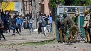 People throw stones on security forces during clashes in Srinagar.(PTI Photo) People throw stones on security forces during clashes in Srinagar.(PTI Photo)