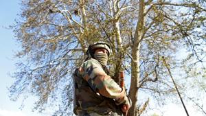 An Indian army soldier stands guard near the scene of an attack on a Indian Central Reserve Police Force (CRPF) convoy at Panthachowk on the outskirts of Srinagar on April 3, 2017.(AFP FILE PHOTO) An Indian army soldier stands guard near the scene of an attack on a Indian Central Reserve Police Force (CRPF) convoy at Panthachowk on the outskirts of Srinagar on April 3, 2017.(AFP FILE PHOTO)