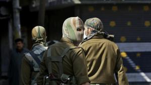 Masked policemen patrol at a closed market during a strike in Srinagar on Monday.(AP Photo) Masked policemen patrol at a closed market during a strike in Srinagar on Monday.(AP Photo)