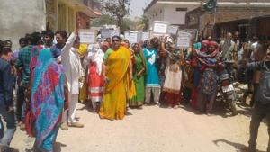 Bhopal, India - April 12, 2017: Women staging a demonstration to protest against a liquor shop in Chhatarpur. Bhopal, India - April 12, 2017: Women staging a demonstration to protest against a liquor shop in Chhatarpur.