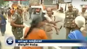 A cop allegedly slapped a woman and shoved two protesters who were demonstrating against liquor shops in Tirupur, Tamil Nadu.(Video screengrab) A cop allegedly slapped a woman and shoved two protesters who were demonstrating against liquor shops in Tirupur, Tamil Nadu.(Video screengrab)