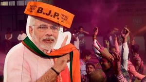 BJP workers play holi with a giant cut-out of Prime Minister Narendra Modi as they celebrate the party’s victory in the UP and Uttarakhand Assembly elections, at the party headquarters in New Delhi on March 11.(PTI) BJP workers play holi with a giant cut-out of Prime Minister Narendra Modi as they celebrate the party’s victory in the UP and Uttarakhand Assembly elections, at the party headquarters in New Delhi on March 11.(PTI)