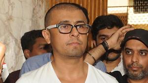 Sonu Nigam stands after shaving his head in Mumbai. Nigam shaved his head and insisted he was not Sonu Nigam stands after shaving his head in Mumbai. Nigam shaved his head and insisted he was not