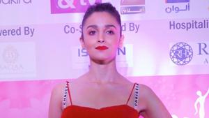 Alia Bhatt in the red Dior dress that revealed her bra straps with the Dior logo.(HT Photo/ Viral Bhayani) Alia Bhatt in the red Dior dress that revealed her bra straps with the Dior logo.(HT Photo/ Viral Bhayani)