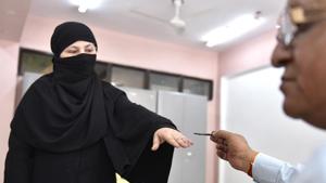 A Muslim lady casting her vote at polling booth near Jama Masjid on Sunday.(Arvind Yadav/Hindustan Times) A Muslim lady casting her vote at polling booth near Jama Masjid on Sunday.(Arvind Yadav/Hindustan Times)