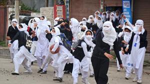 Girl students pelt stones at security personnel during clashes in the vicinity of Lal Chowk in Srinagar on April 24.(PTI Photo) Girl students pelt stones at security personnel during clashes in the vicinity of Lal Chowk in Srinagar on April 24.(PTI Photo)