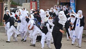 Girl students pelt stones at security personnel during clashes in the vicinity of Lal Chowk in Srinagar on April 24.(PTI Photo) Girl students pelt stones at security personnel during clashes in the vicinity of Lal Chowk in Srinagar on April 24.(PTI Photo)