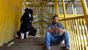 A Kashmiri man browses the internet on his mobile phone on a footbridge in Srinagar.(AFP Photo) A Kashmiri man browses the internet on his mobile phone on a footbridge in Srinagar.(AFP Photo)