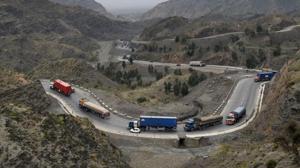 Trucks and other vehicles travel in the mountainous area near Torkham, close to the Pakistan-Afghanistan border, on March 21.(AFP Photo) Trucks and other vehicles travel in the mountainous area near Torkham, close to the Pakistan-Afghanistan border, on March 21.(AFP Photo)