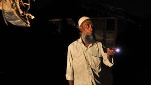 Kamal Hussain, a Rohingya Muslim, stands guard outside a settlement at night in Jammu.(Waseem Andrabi/HT Photo) Kamal Hussain, a Rohingya Muslim, stands guard outside a settlement at night in Jammu.(Waseem Andrabi/HT Photo)