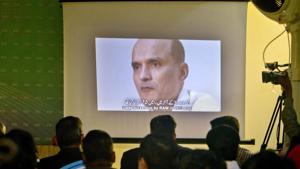 In this March 29, 2016 photo, journalists look at an image of Indian naval officer Kulbhushan Jadhav, who was arrested in March 2016, during a press conference by Pakistan's army spokesman in Islamabad, Pakistan.(AP Photo) In this March 29, 2016 photo, journalists look at an image of Indian naval officer Kulbhushan Jadhav, who was arrested in March 2016, during a press conference by Pakistan's army spokesman in Islamabad, Pakistan.(AP Photo)