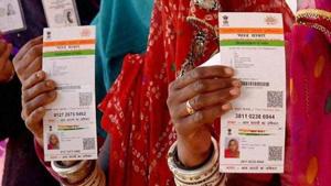 Women with Aadhaar cards in Ajmer , Rajasthan(PTI File Photo) Women with Aadhaar cards in Ajmer , Rajasthan(PTI File Photo)