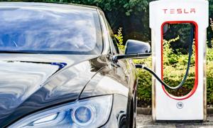 The Black Tesla Model S electric car at a Tesla supercharger charging station. Superchargers are free connectors that charge Model S in minutes. Tesla and Uber (and Ola in India) are current and future providers of public transport networks without which cities will be unable to do business.(Getty Images) The Black Tesla Model S electric car at a Tesla supercharger charging station. Superchargers are free connectors that charge Model S in minutes. Tesla and Uber (and Ola in India) are current and future providers of public transport networks without which cities will be unable to do business.(Getty Images)