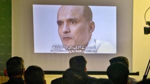In this file photo, journalists look at an image of former Indian naval officer Kulbhushan Jadhav, who was arrested in March 2016 in Balochistan.(AP File Photo) In this file photo, journalists look at an image of former Indian naval officer Kulbhushan Jadhav, who was arrested in March 2016 in Balochistan.(AP File Photo)