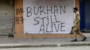A policeman patrols the streets days after Hizbul militant commander Burhan Wani was killed in July 2016. Militant leader Zakir Musa is believed to have been heading the group’s operations in Kashmir after Wani’s death.(PTI File Photo) A policeman patrols the streets days after Hizbul militant commander Burhan Wani was killed in July 2016. Militant leader Zakir Musa is believed to have been heading the group’s operations in Kashmir after Wani’s death.(PTI File Photo)