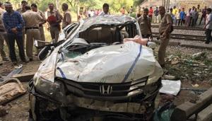 It took the police over 15 minutes to pull the students out as the car was completely damaged. The car skid off the flyover and fell off to land upside down on the ground.(HT Photo) It took the police over 15 minutes to pull the students out as the car was completely damaged. The car skid off the flyover and fell off to land upside down on the ground.(HT Photo)