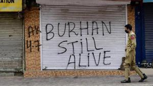 A policeman walks through a deserted street in Srinagar during a strike declared by separatists recently. Zakir Musa took over the reins of the Hizbul Mujahideen in Kashmir after the encounter killing of Burhan Wani by security forces last year.(PTI photo) A policeman walks through a deserted street in Srinagar during a strike declared by separatists recently. Zakir Musa took over the reins of the Hizbul Mujahideen in Kashmir after the encounter killing of Burhan Wani by security forces last year.(PTI photo)