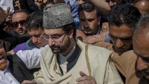 All Parties Hurriyat Conference Chairman Mirwaiz Umar Farooq, stands with supporters during a protest in Srinagar.(AP)