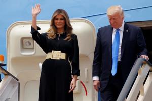US President Donald Trump and first lady Melania Trump arrive aboard Air Force One at King Khalid International Airport in Riyadh, Saudi Arabia, on Saturday.(Reuters)