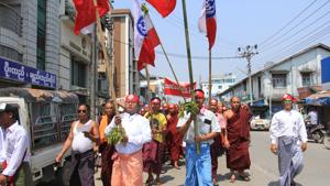 Hard-line Buddhists including monks walk through a street during a protest march, led by Rakhine State's dominant Arakan National Party, against the government's plan to give citizenship to some members of the persecuted Rohingya Muslim minority community in Sittwe, Rakhine state, Myanmar on March 19.(AP File Photo) Hard-line Buddhists including monks walk through a street during a protest march, led by Rakhine State's dominant Arakan National Party, against the government's plan to give citizenship to some members of the persecuted Rohingya Muslim minority community in Sittwe, Rakhine state, Myanmar on March 19.(AP File Photo)