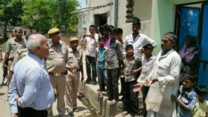 Uttar Pradesh home secretary Mani Prasad Mishra interacts with villagers in Shabeerpur on Wednesday.(HT file photo) Uttar Pradesh home secretary Mani Prasad Mishra interacts with villagers in Shabeerpur on Wednesday.(HT file photo)