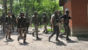 Army soldiers and policemen patrol after an encounter, in which Hizbul commander Sabzar Ahmad Bhatwas killed, ends at Saimoh village in Tral, on May 27.(Waseem Andrabi / HT Photo) Army soldiers and policemen patrol after an encounter, in which Hizbul commander Sabzar Ahmad Bhatwas killed, ends at Saimoh village in Tral, on May 27.(Waseem Andrabi / HT Photo)
