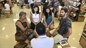 Readers listen to stories from people acting as human libraries at Title Waves, Bandra, on Sunday.(Pratik Chorge/Hindustan Times) Readers listen to stories from people acting as human libraries at Title Waves, Bandra, on Sunday.(Pratik Chorge/Hindustan Times)