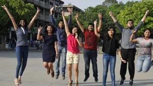 (From left) Mehar Virk (overall 3rd in tricity), Pragati Sharma (6th), Sanat Goel (3rd), Neha Goyal (4th), Saurabh Gupta (3rd), Tanya Goyal (5th), Prabhmaan Singh Thapar (6th) and Prachi Jaiswal (5th) celebrating their success at Sector 17 in Chandigarh on Sunday.(Karun Sharma/HT Photo)