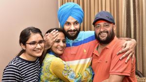 Anmol Sher Singh celebrates with his family at his resident in Amritsar.(Gurpreet Singh/HT)