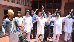 Villagers and relatives of Tanmanjeet Singh Dhesi, the first turbaned Sikh MP in Britain’s House of Commons, celebrating his victory as by distributing sweets and dancing to the beat of the dhol at his native Raipur village in Jalandhar district on Friday.(HT Photo) Villagers and relatives of Tanmanjeet Singh Dhesi, the first turbaned Sikh MP in Britain’s House of Commons, celebrating his victory as by distributing sweets and dancing to the beat of the dhol at his native Raipur village in Jalandhar district on Friday.(HT Photo)