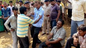 Family members of two persons who were trapped in an underground fire after land caved-in a coal mine area at Jharia Sindri main road, mourn in Dhanbad.(PTI Photo) Family members of two persons who were trapped in an underground fire after land caved-in a coal mine area at Jharia Sindri main road, mourn in Dhanbad.(PTI Photo)