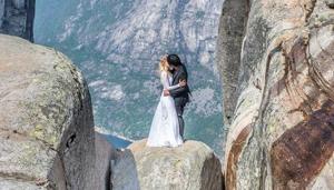 The couple can be seen kissing in their wedding outfits on the Norway Rock (Keow Wee Loong Facebook) The couple can be seen kissing in their wedding outfits on the Norway Rock (Keow Wee Loong Facebook)